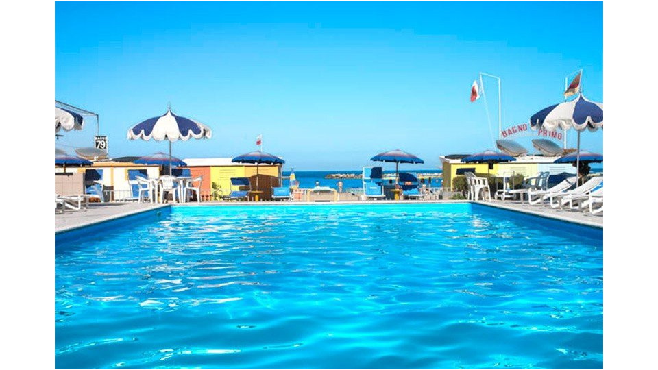 Sunny swimming pool on the sea