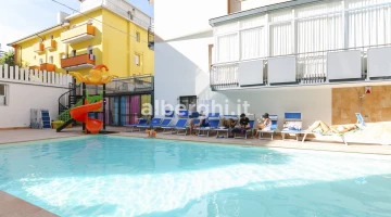 Temperate swimming pool with slides and children&#39;s games