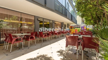 External area with tables, chairs and children's outdoor play area