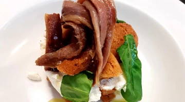 marinated anchovies on spiced croutons and ricotta