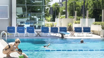 Outdoor swimming pool with children&#39;s play area