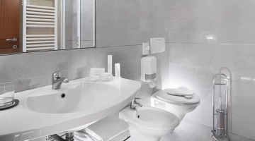 The bathroom with a comfortable shower box