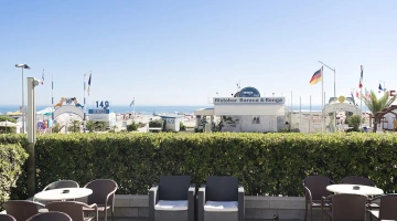 The outdoor terrace with lounges, tables and armchairs