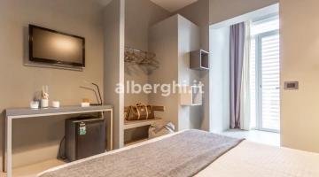 Camera quadrupla deluxe